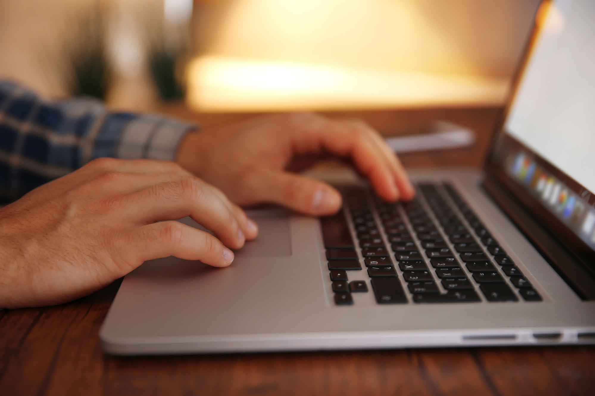 freight broker tms - Young man using his laptop